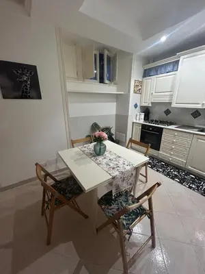 a living room with two couches and a table at Home in Trastevere Testaccio in Rome