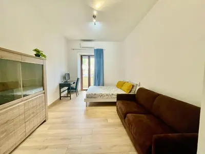 a living room with a couch and a large aquarium at ZAMA HOME in Rome