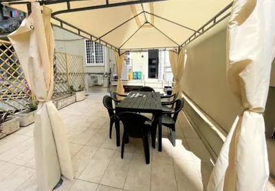 a dining room with a table and chairs at ZAMA HOME in Rome