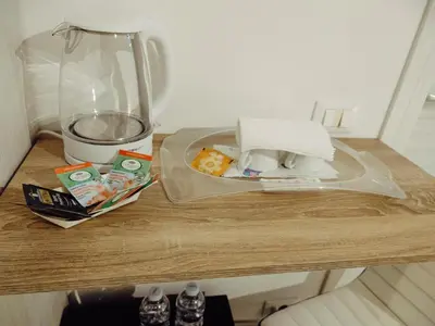 a table with a plate of food and a blender at Bosuites Rome in Rome