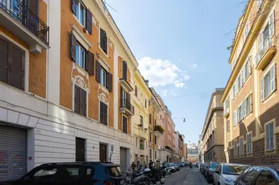 a street in a city with buildings and cars at Borgo Terrace by Rental in Rome in Rome