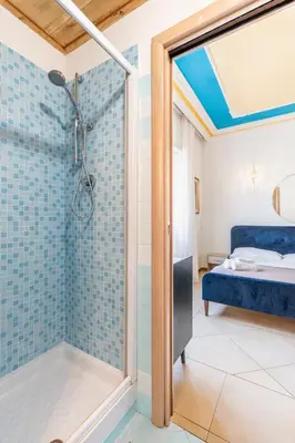 a bathroom with a shower and a bedroom at Gregorio VII - Deliziosa sistemazione a due passi da San Pietro in Rome
