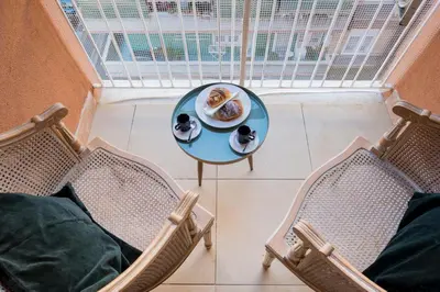 a table with a plate of food and two chairs at Gregorio VII - Deliziosa sistemazione a due passi da San Pietro in Rome