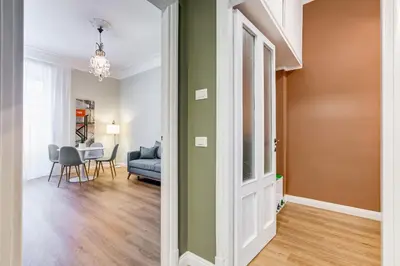 a hallway with a living room and a dining room at Flaminio Lovely House in Rome