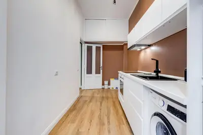 a kitchen with a sink and a washing machine at Flaminio Lovely House in Rome