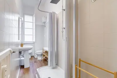 a bathroom with a shower and a sink and a toilet at Flaminio Lovely House in Rome