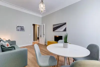 a living room with a white table and chairs at Flaminio Lovely House in Rome