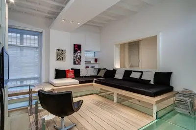 a kitchen with a table and a dining room at Trevi Loft in Rome