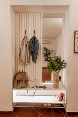 a mirror in a living room with a window at Alloggio Re di Roma 43 in Rome
