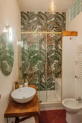 a bathroom with a shower and a sink at Alloggio Re di Roma 43 in Rome