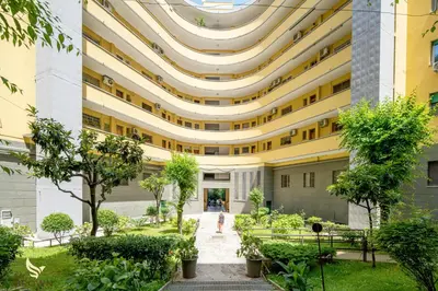 a large building with a walkway in front of it at Mr Brown - Monteverde House in Rome