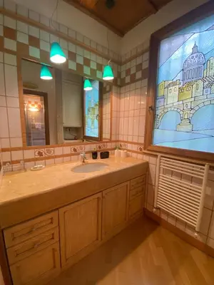 a bathroom with a sink and a large window at sweet home Laurina in Rome