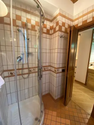 a bathroom with a shower with a glass door at sweet home Laurina in Rome