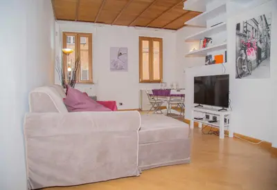 a living room with a couch and a television at sweet home Laurina in Rome