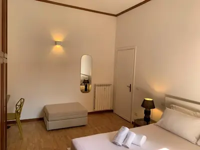a kitchen with a table with a plant on it at Nox Romana Apartments - Vatican - Threeroom Apt with 2 Bathroom in Rome