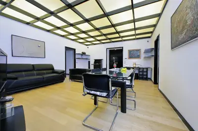 a living room with a couch and a table at 4BNB - Spacious Porta Pia Apartment in Rome