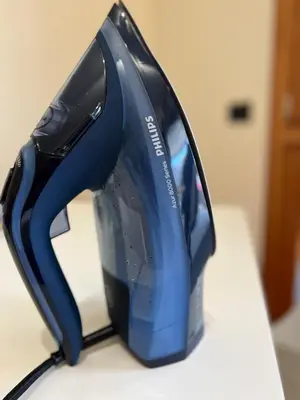 a blue iron sitting on top of a table at Mary's house in Rome