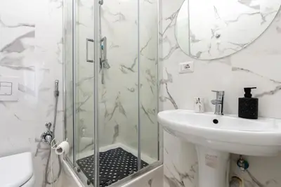 a bathroom with a sink and a shower at Amazing apartment near to Colosseo and subway in Rome