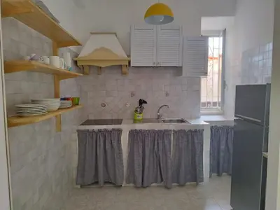 a kitchen with a sink and a stove at Appartamento Elena & Chiara in Rome