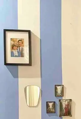 a group of pictures hanging on a wall at Anna’s Crazy Place in Rome