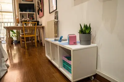 a room with a white cabinet with a plant on it at Anna’s Crazy Place in Rome