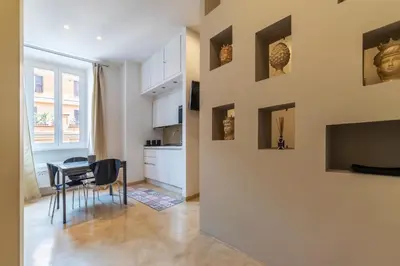 a kitchen and dining room with a table and chairs at GuestHost - Bright Apartment near Villa Borghese in Rome