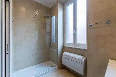 a bathroom with a shower and a glass shower stall at GuestHost - Bright Apartment near Villa Borghese in Rome