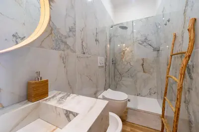 a bathroom with a tub and a toilet and a sink at Casa Cattaneo, a due passi da Santa Maria Maggiore in Rome