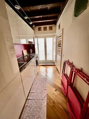 a kitchen with a counter top and a kitchen sidx sidx sidx sidx at Torre della Scimmia apartment in Rome