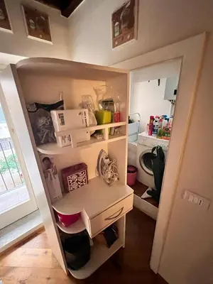 a small kitchen with a desk in a room at Torre della Scimmia apartment in Rome