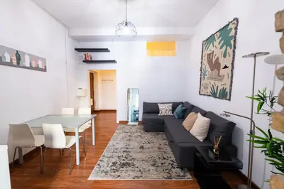 a living room with a couch and a table at La Pietra al Pigneto in Rome