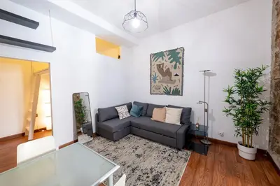 a living room with a couch and a table at La Pietra al Pigneto in Rome