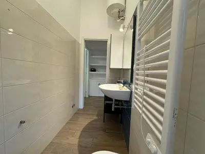 a bathroom with a sink and a toilet in it at Casa Marin - Metro Malatesta in Rome