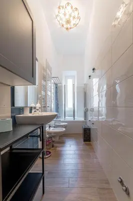 a bathroom with two sinks and two toilets at Casa Marin - Metro Malatesta in Rome