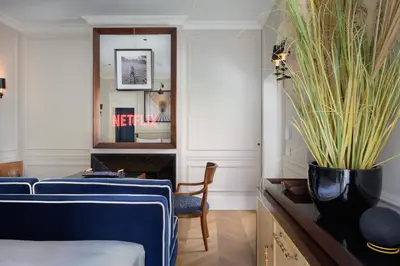 a room with two beds and a mirror at Casa Violante Luxury Apartment in Rome