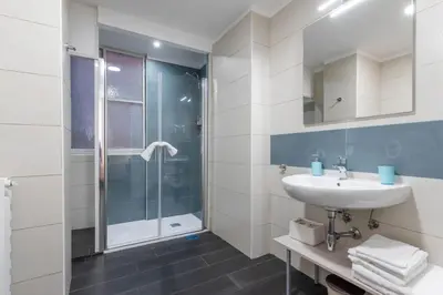 a bathroom with a sink and a shower at Velvet Rooms in Rome