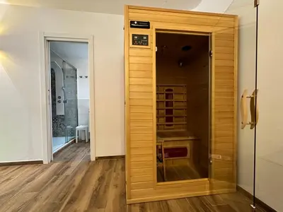 a wooden door in a room with a hallway at Relais Romagnosi in Rome