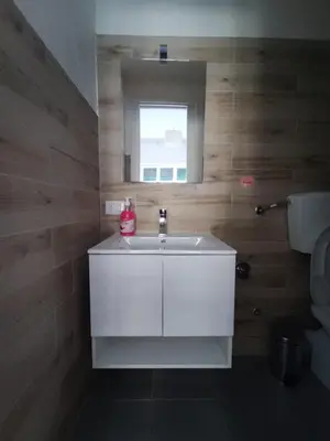 a bathroom with a white sink and a window at Style House 74 in Rome
