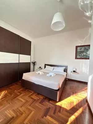 a bedroom with a large bed in a room at Trastevere Rome's Heart Charming & Cozy appartment 3 in Rome