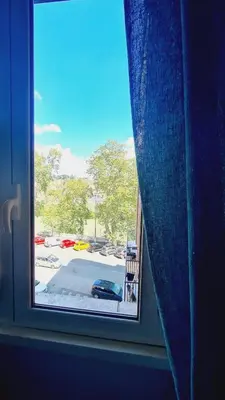 a window with a view of a parking lot at Trastevere Rome's Heart Charming & Cozy appartment 3 in Rome