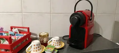 a kitchen counter with a red blender on a counter top at Sunflower House in Rome