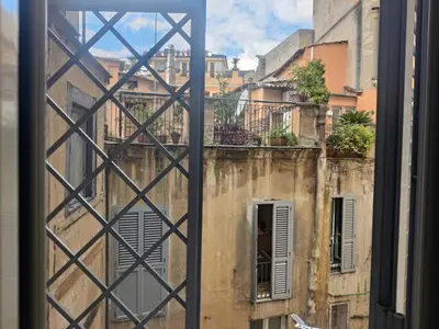 a view from a window of an old building at Warm Charming Apartment in Campo de Fiori in Rome