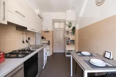 a kitchen with a sink and a stove top oven at [Roma Termini] - Suite elegante in Rome