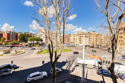 a city street with cars parked on the street at My Sweet R-home in Vatican in Rome