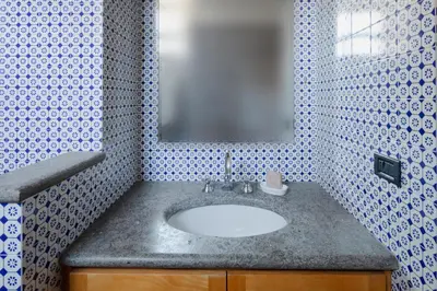 a bathroom with a sink and a mirror at Quiet apartment in the heart of Trastevere in Rome