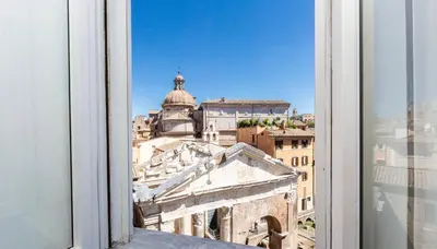 a view of a city from a window at Portico d'Ottavia LUX in Rome