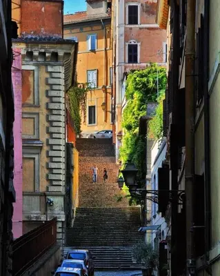 a group of people walking down a stairway at Nannì Vatican House in Rome