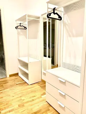 a dressing room with white cabinets and a mirror at Dimora Centro Storico Roma in Rome