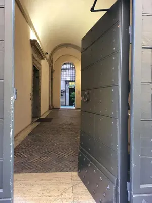 an empty hallway with a door in a building at The Rabbit Hole in Rome