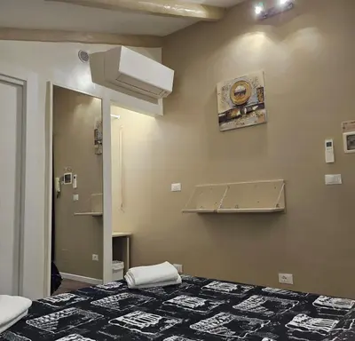 a hospital room with a bed and a mirror at The Fox Cove in Rome